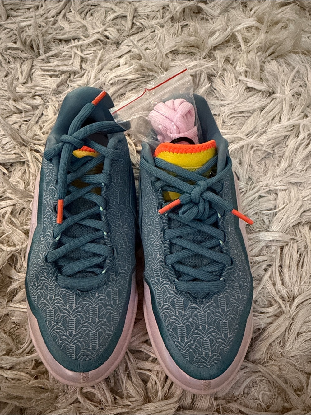 Nike Kids Teal Patterned Sneakers with Pink Sole and Rainbow Tongue